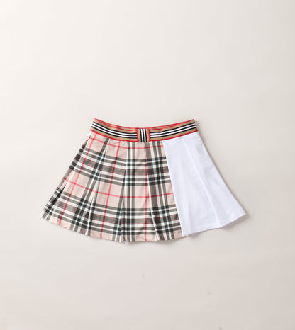 THE AGGIE BROWN PLAID SKORT— POLISHED PLAID FOR PLAY, PRACTICE, AND POST-MATCH PLANS.